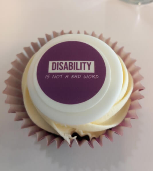 Disability is not a bad word decorated cupcake.